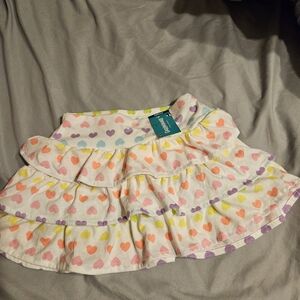New Skirt with shorts under size 5T. With with neon hearts